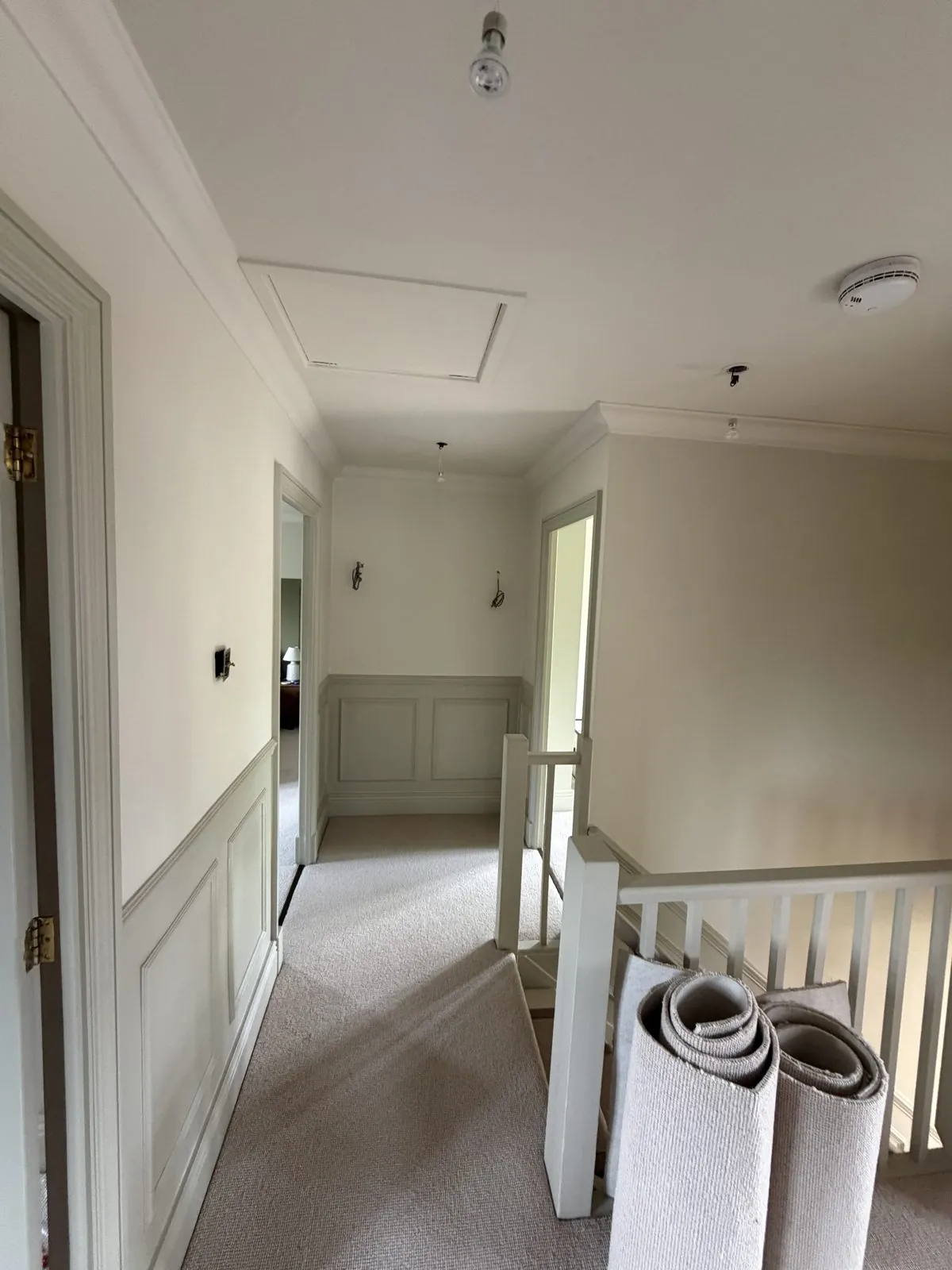 Grey wall panelling on a landing